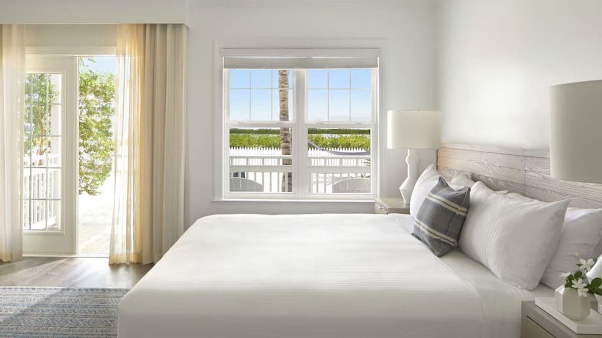 Romantic king room with natural light at Parrot Key Hotel & Villas.