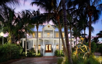 Hotel exterior at dusk at Parrot Key Hotel & Villas.