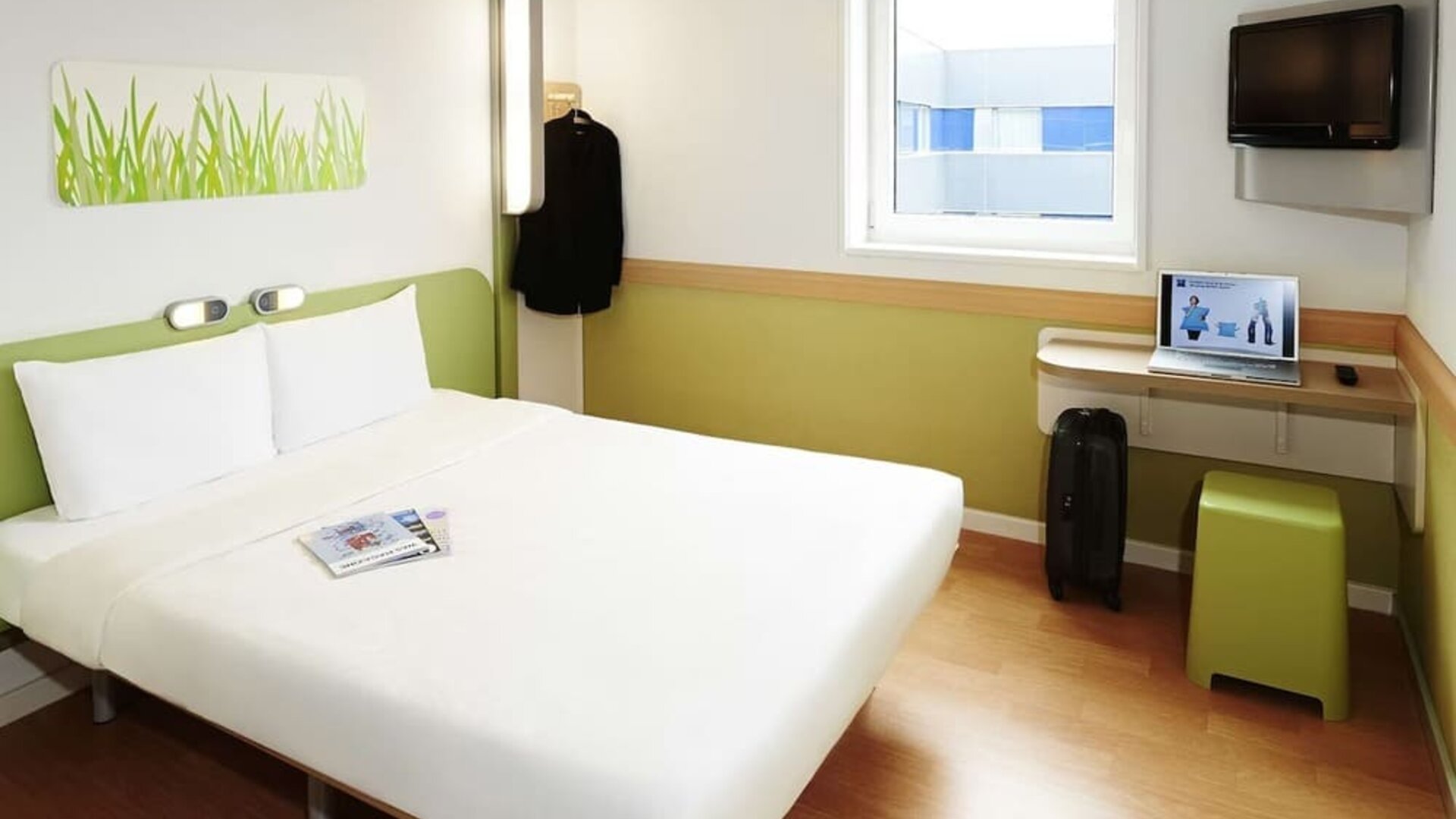 Bright and spacious day use room with work desk at Hotel IBIS Budget Birmingham Airport.