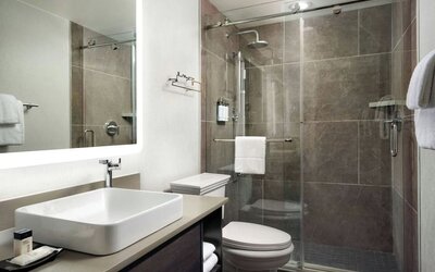 Guest bathroom with shower at Union Station Hotel Nashville.