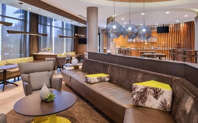 Lobby and coworking lounge at SpringHill Suites By Marriott Irvine John Wayne Airport/Orange County.