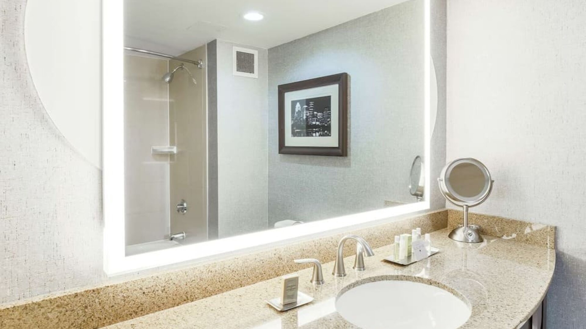 Guest bathroom with shower at DoubleTree By Hilton Austin University Area.