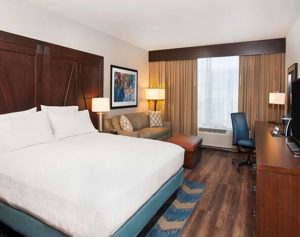 Day use room with work desk and sofa at Hilton Garden Inn Burbank Downtown.
