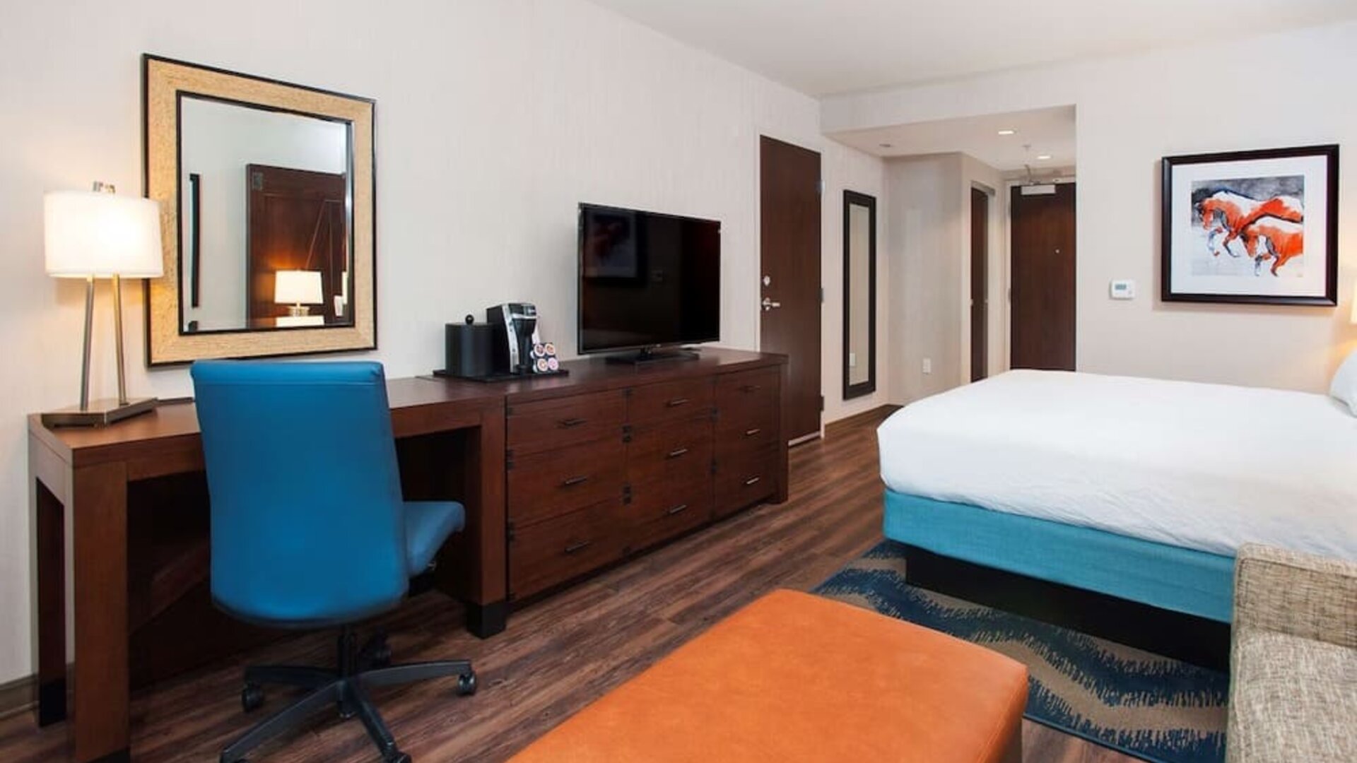 Day use room with work desk and sofa at Hilton Garden Inn Burbank Downtown.