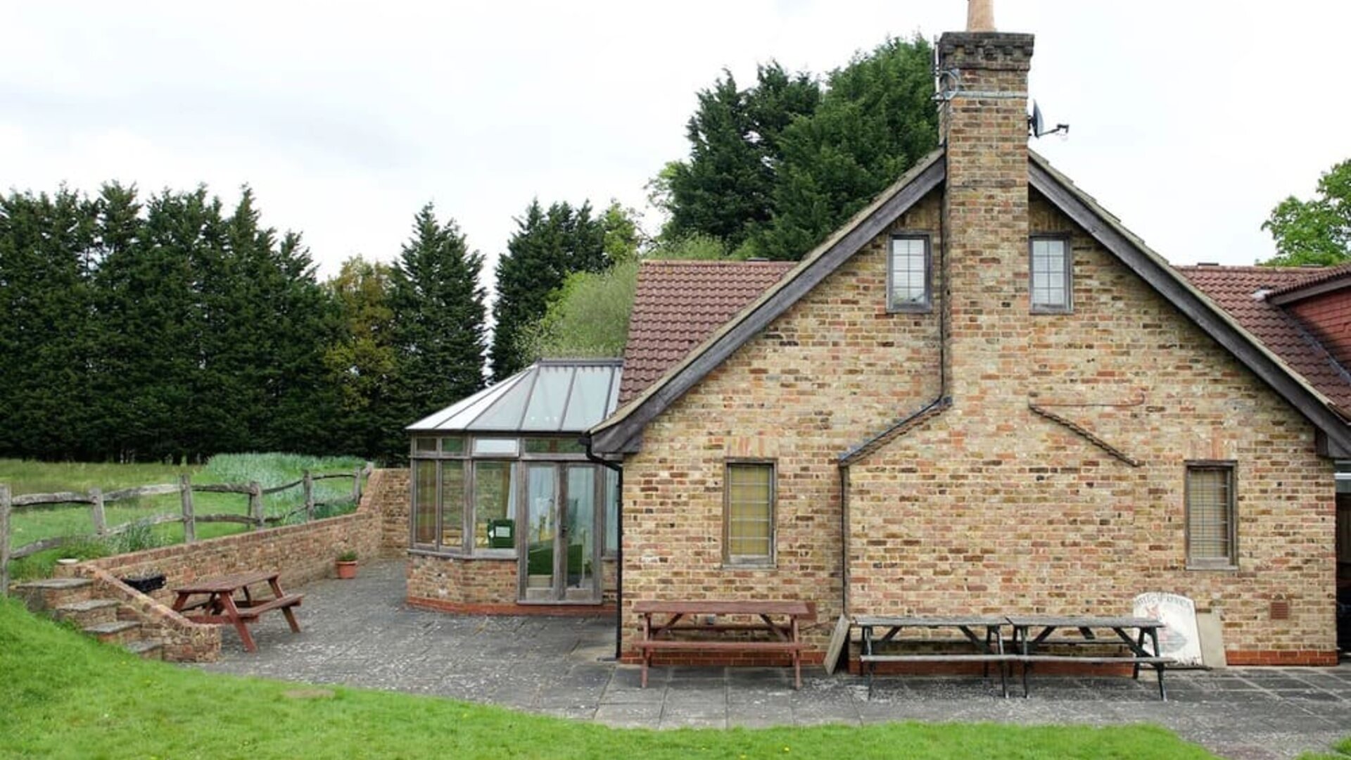 Exterior view and lounge seating at Little Foxes Hotel.