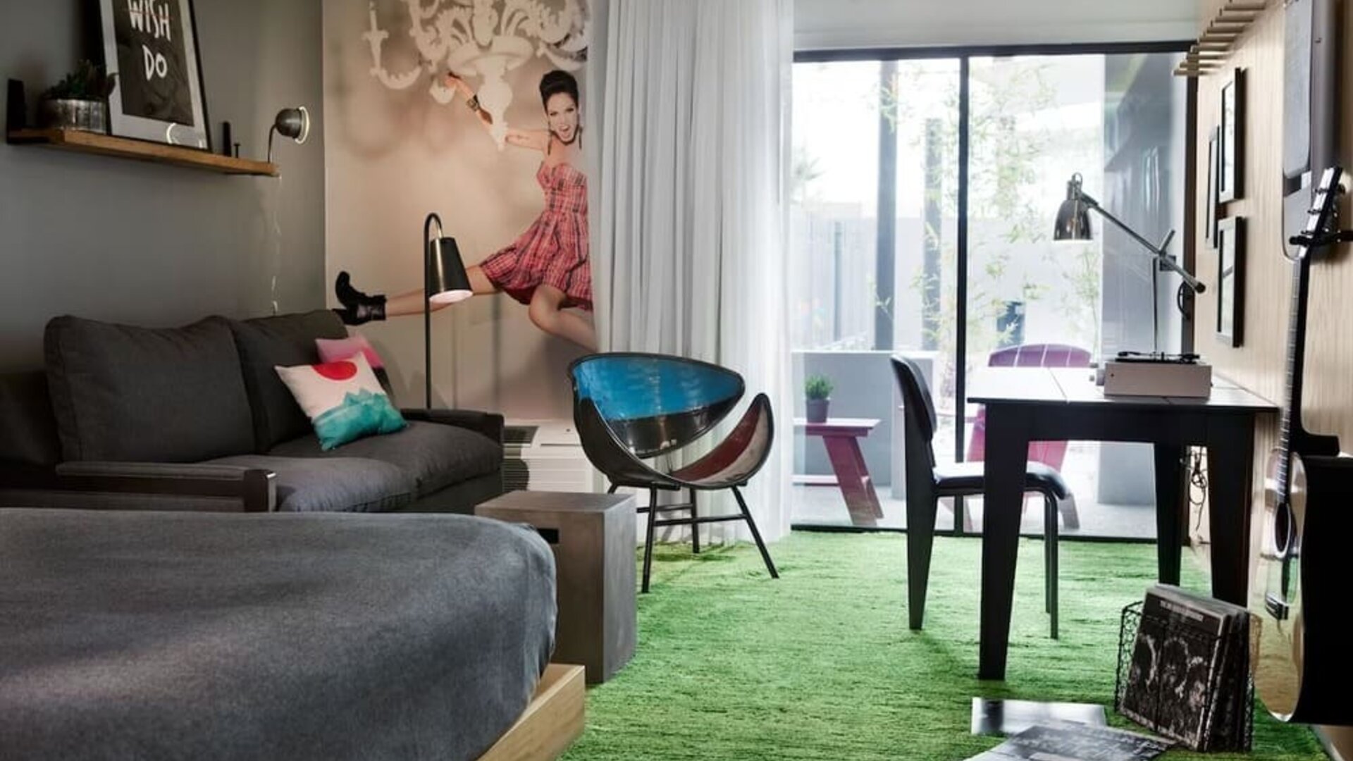 Day use room with sofa, work desk and balcony at Moxy Phoenix Tempe/ASU Area.