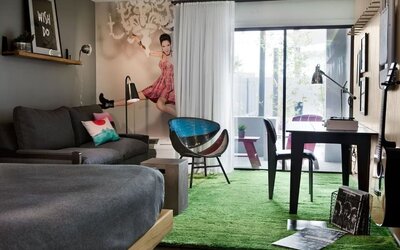 Day use room with sofa, work desk and balcony at Moxy Phoenix Tempe/ASU Area.