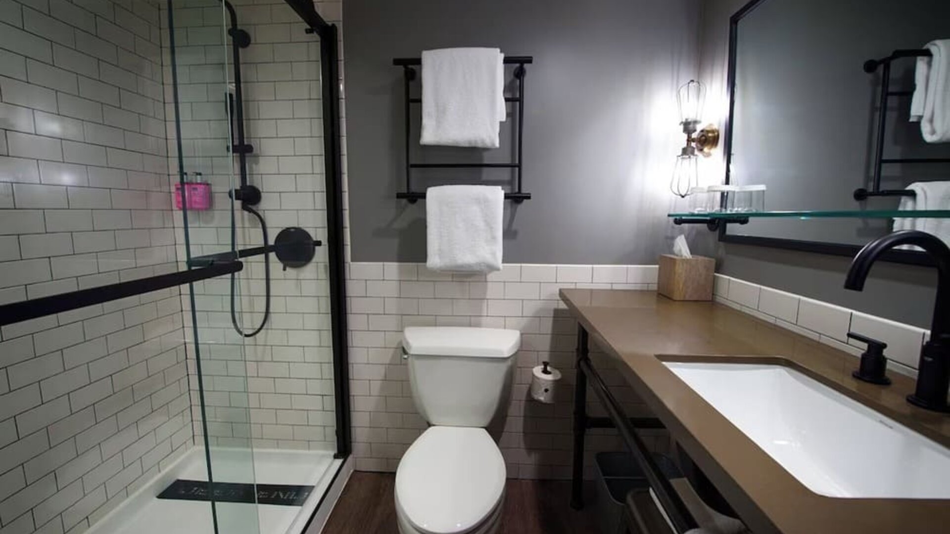 Guest bathroom with shower at Moxy Phoenix Tempe/ASU Area.