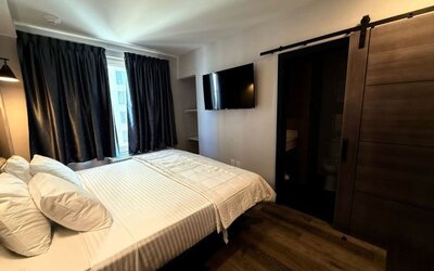 Romantic king bed at BKWAY HOTEL.