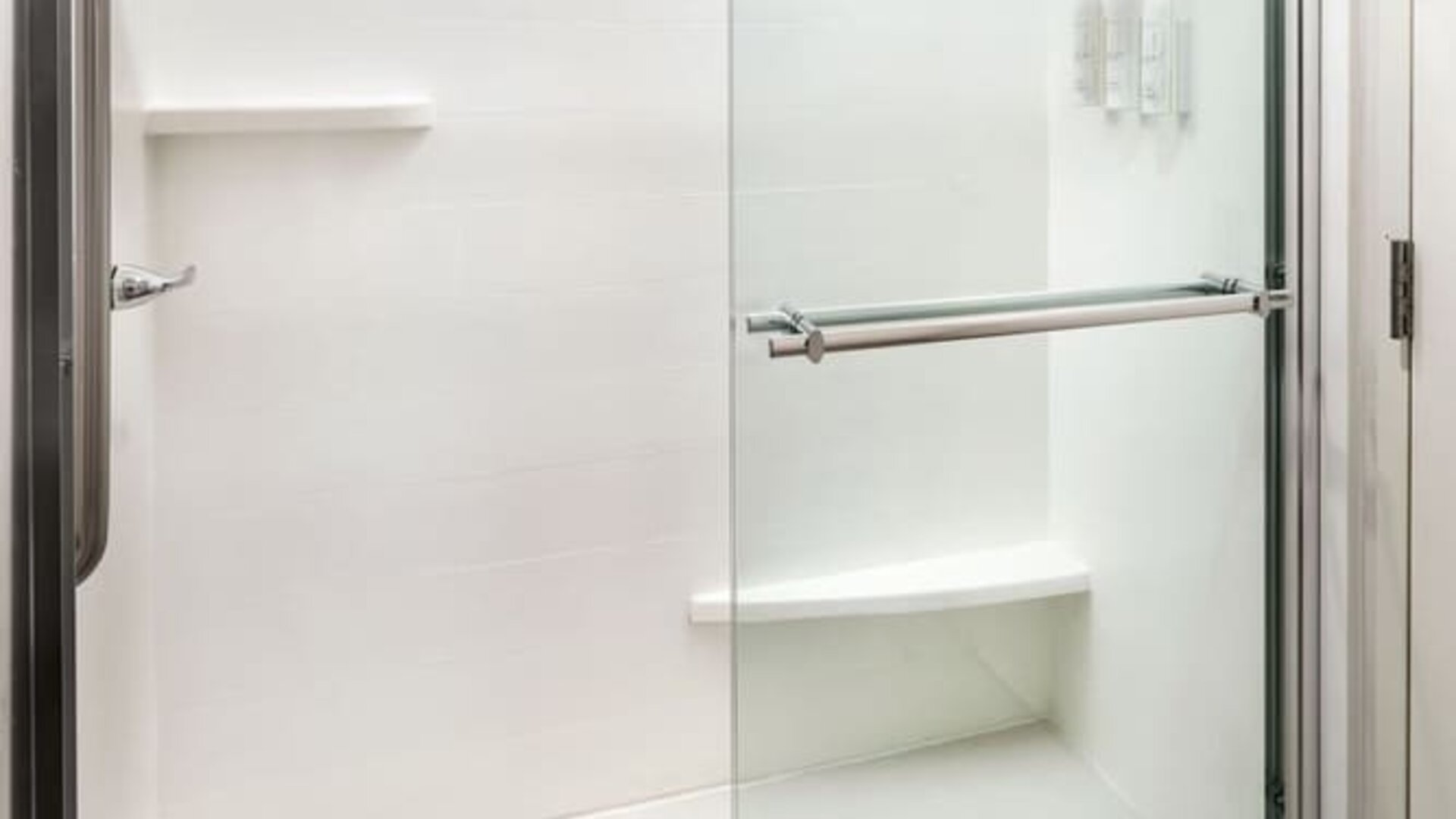 Guest bathroom with shower at Fairfield Inn & Suites By Marriott Jacksonville.