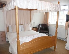 Day use room with lounge chari at Rothwell House Hotel.