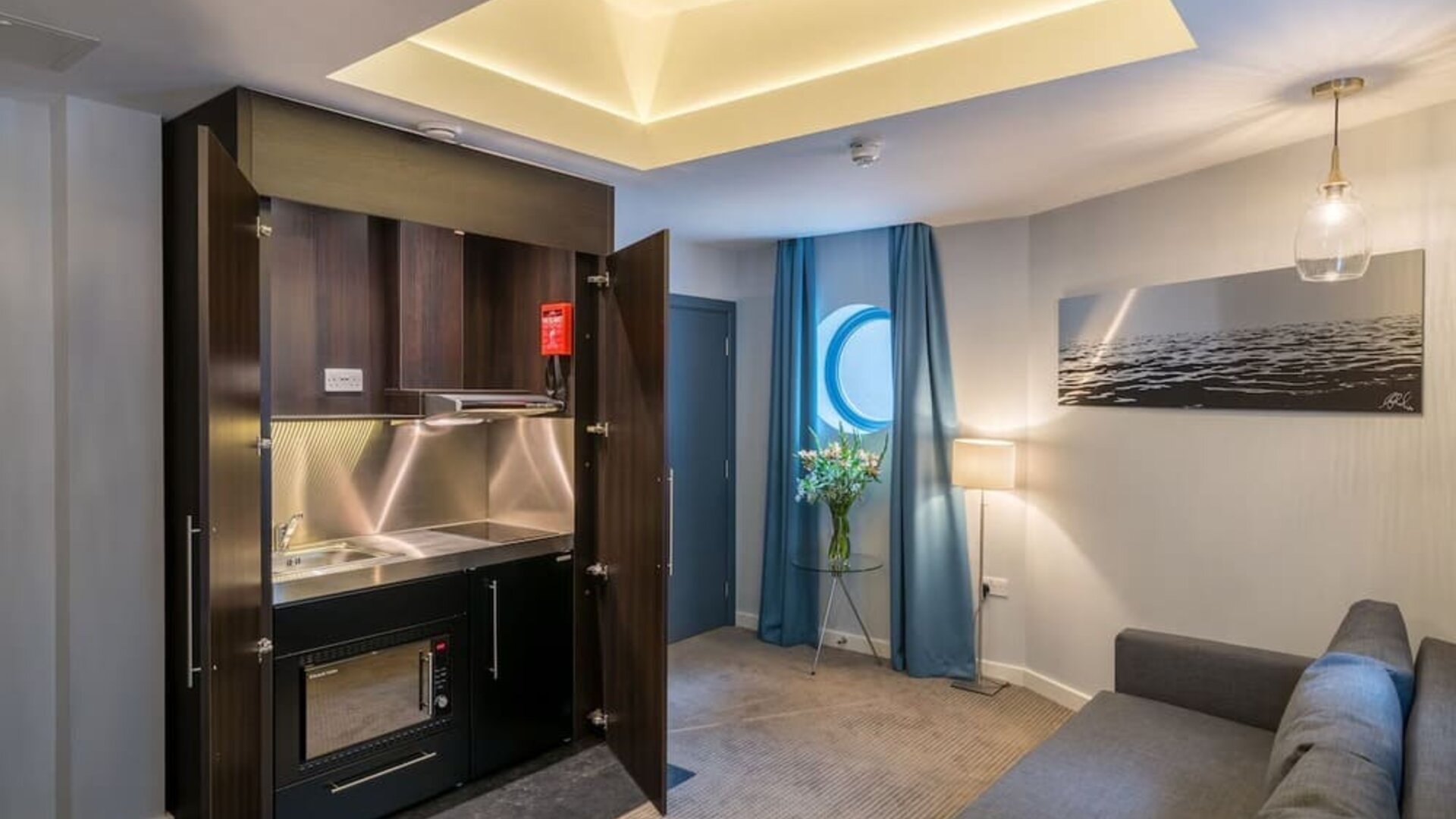 Day use studio suite with in-room kitchen and living area at Pelican London Residence & Hotel.