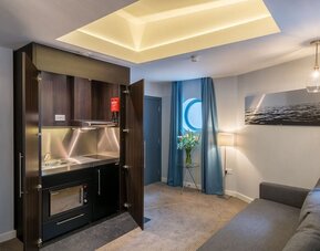 Day use studio suite with in-room kitchen and living area at Pelican London Residence & Hotel.