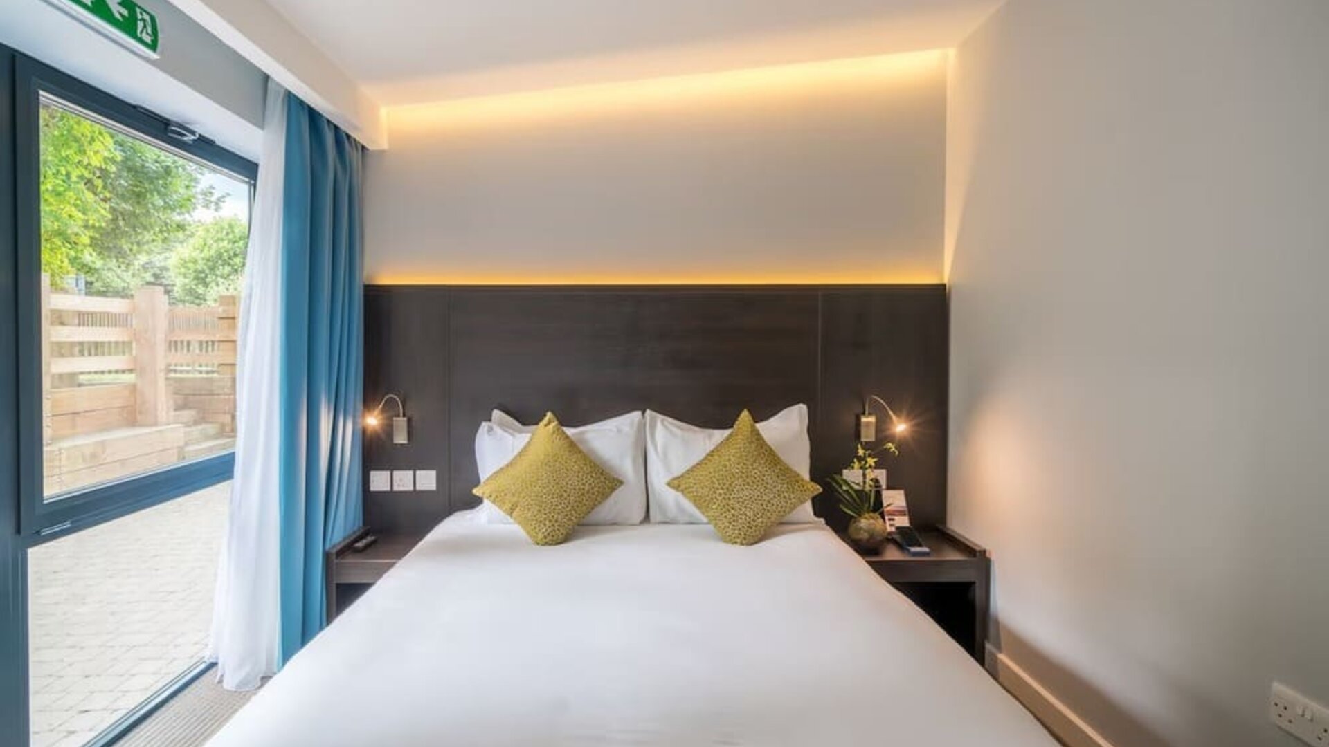 King bed at Pelican London Residence & Hotel.