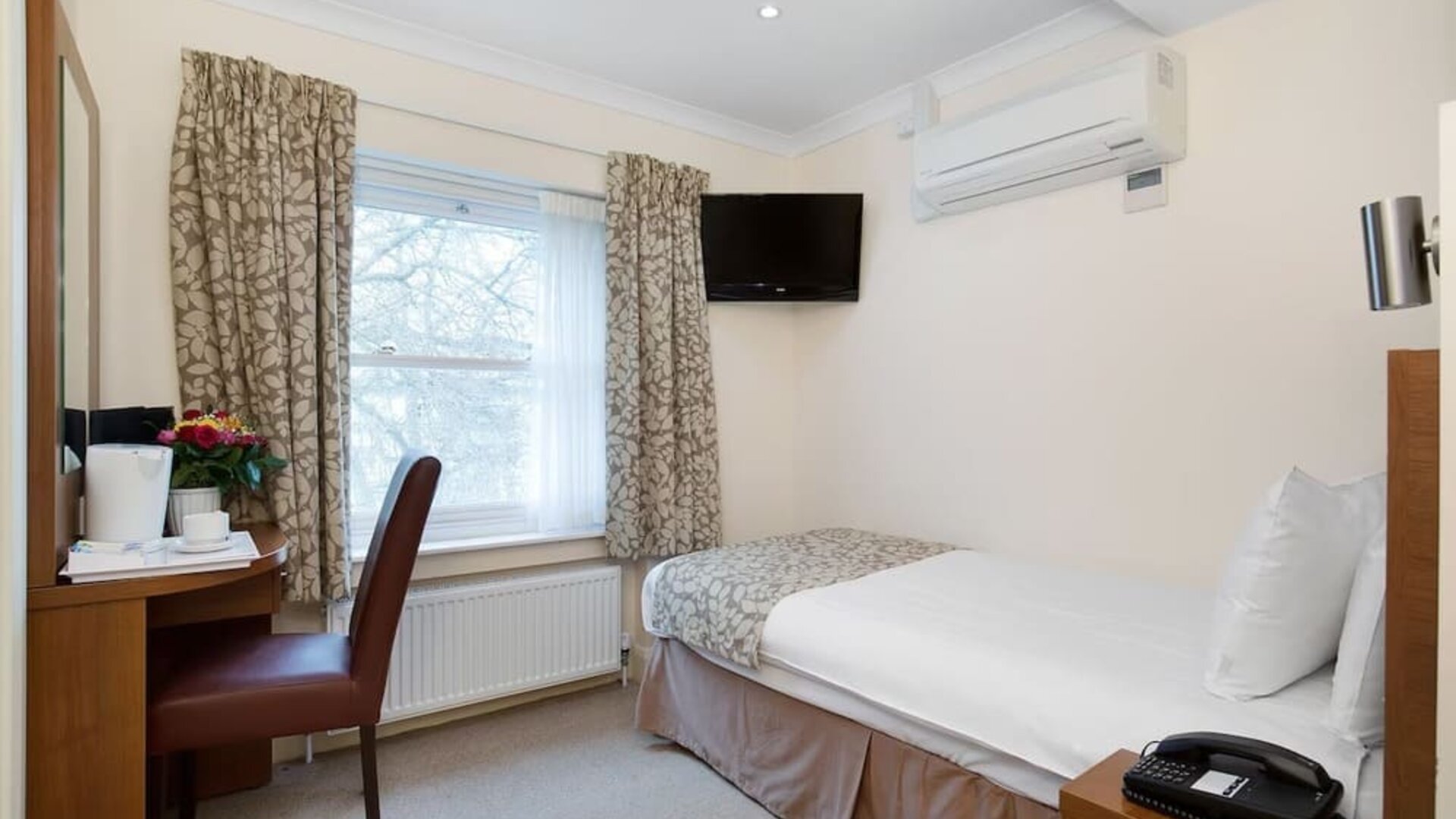 Day use single room with work desk at The Bayswater Inn Hotel.