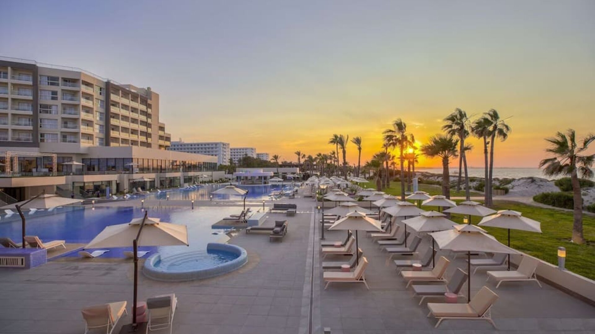 Pool at sunset at Hilton Skanes Monastir Beach Resort.