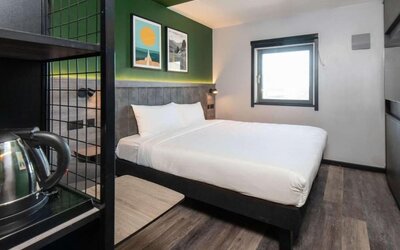 Day use room with king bed at Ibis London Gatwick Airport Hotel.