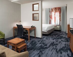 Day use room with living area and work desk at Fairfield Inn & Suites Kansas City Overland Park.