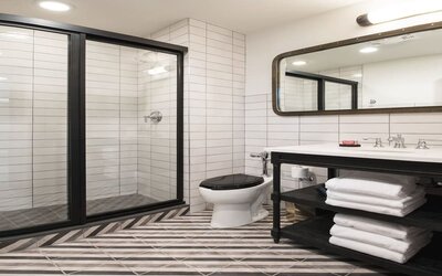 Guest bathroom with shower at The Chicago Hotel Collection River North.