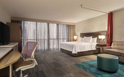 Spacious day use room with work desk and sofa at Home2 Suites By Hilton Chicago River North.
