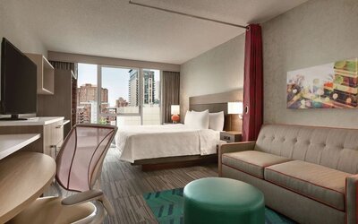 Day use room with work desk and sofa at Home2 Suites By Hilton Chicago River North.
