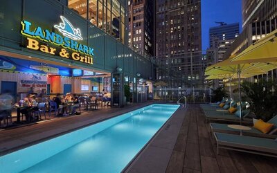 Outdoor pool at night at Margaritaville Resort Times Square.