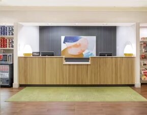 Reception and snack bar at Spark By Hilton Kannapolis.