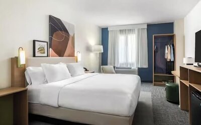 Day room with TV at Spark By Hilton Houston Hobby Airport.