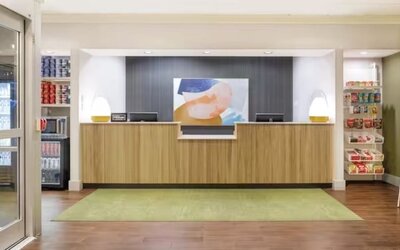 Reception and snack bar at Spark By Hilton Houston Hobby Airport.