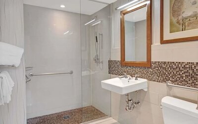 Guest bathroom with shower at Wyndham Garden Chinatown NYC.