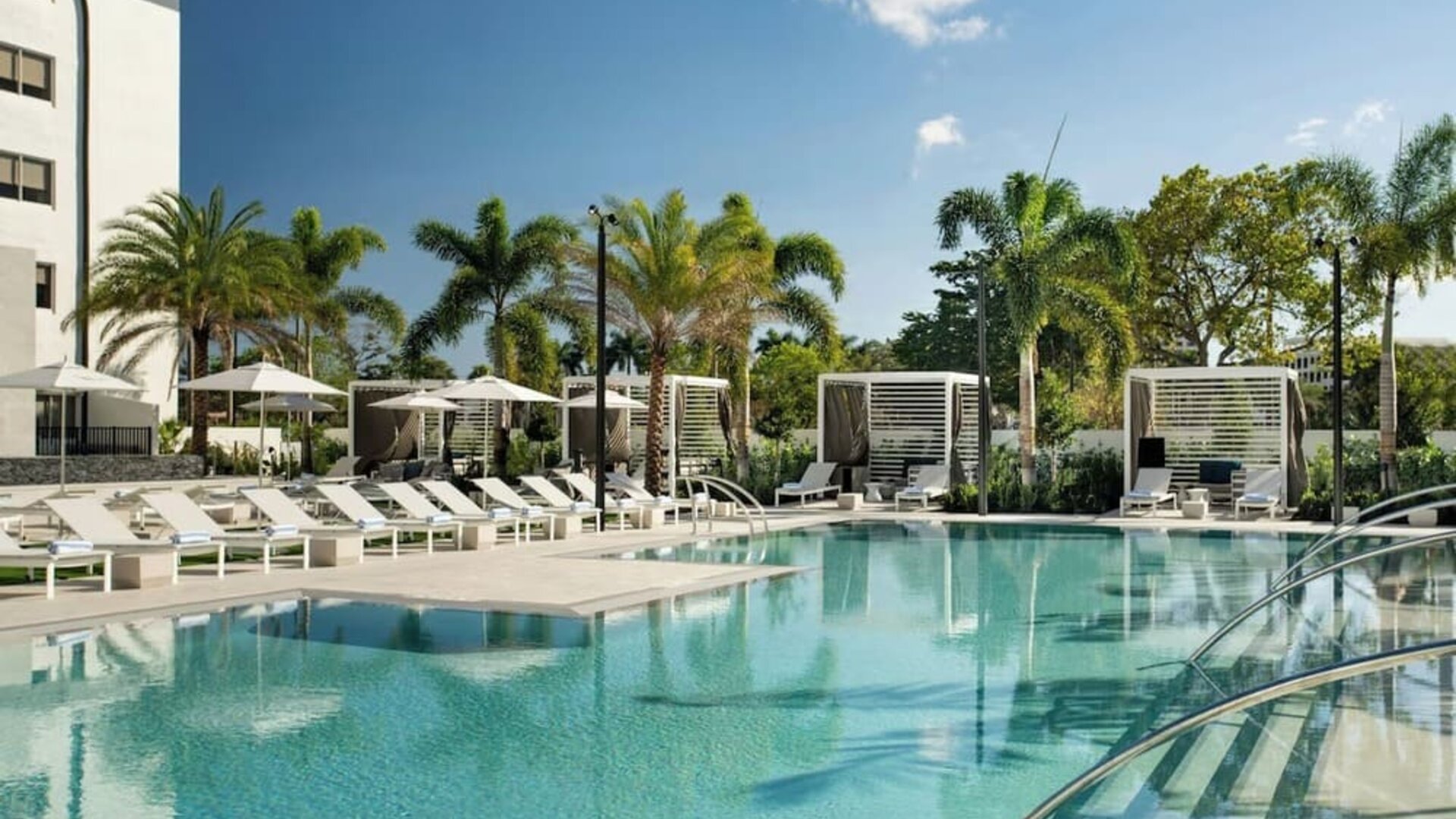 Refreshing outdoor pool surrounded by sun loungers at Renaissance Boca Raton Hotel.
