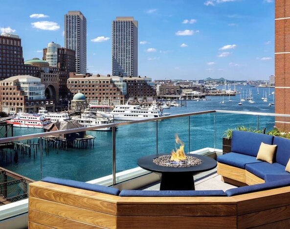 Rooftop furniture with fire pit at The Envoy Hotel, Autograph Collection.