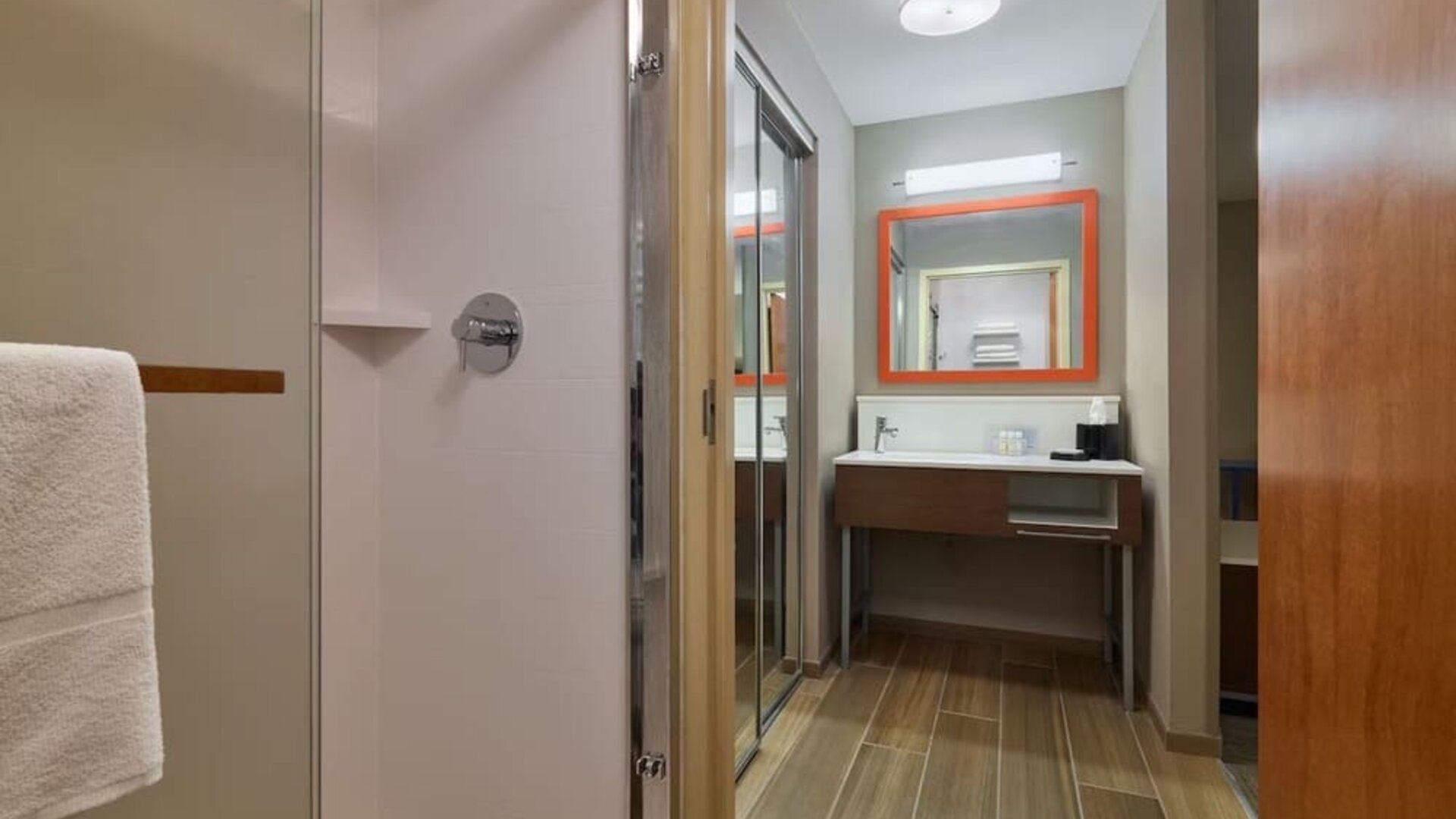 Guest bathroom with shower at Hampton Inn & Suites Providence/Smithfield.