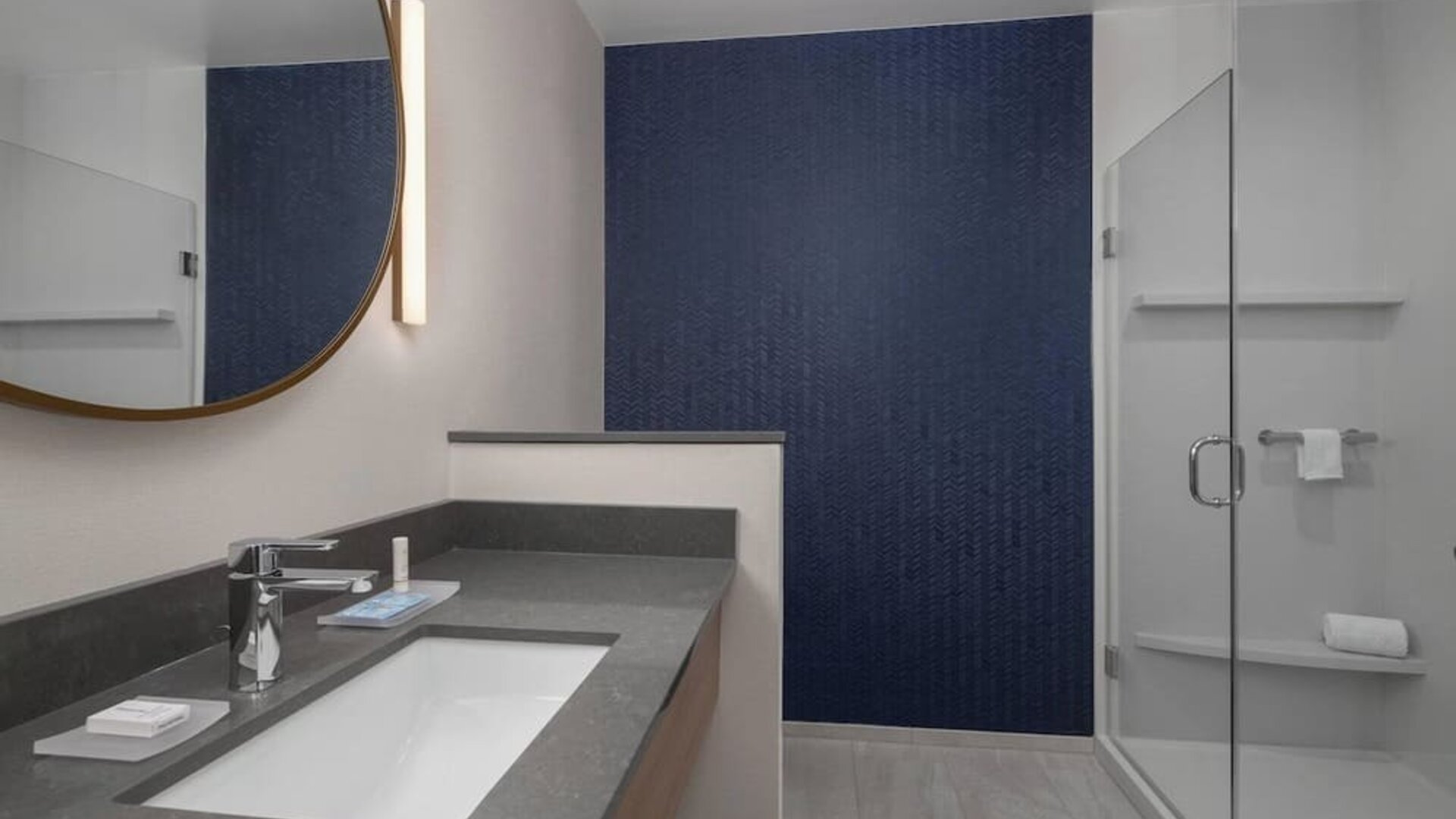 Guest bathroom with shower at Fairfield Inn & Suites By Marriott Kenosha Pleasant Prairie.