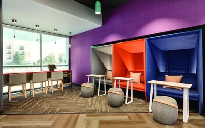 Comfortable working space with natural light at Tru By Hilton Wichita Northeast.
