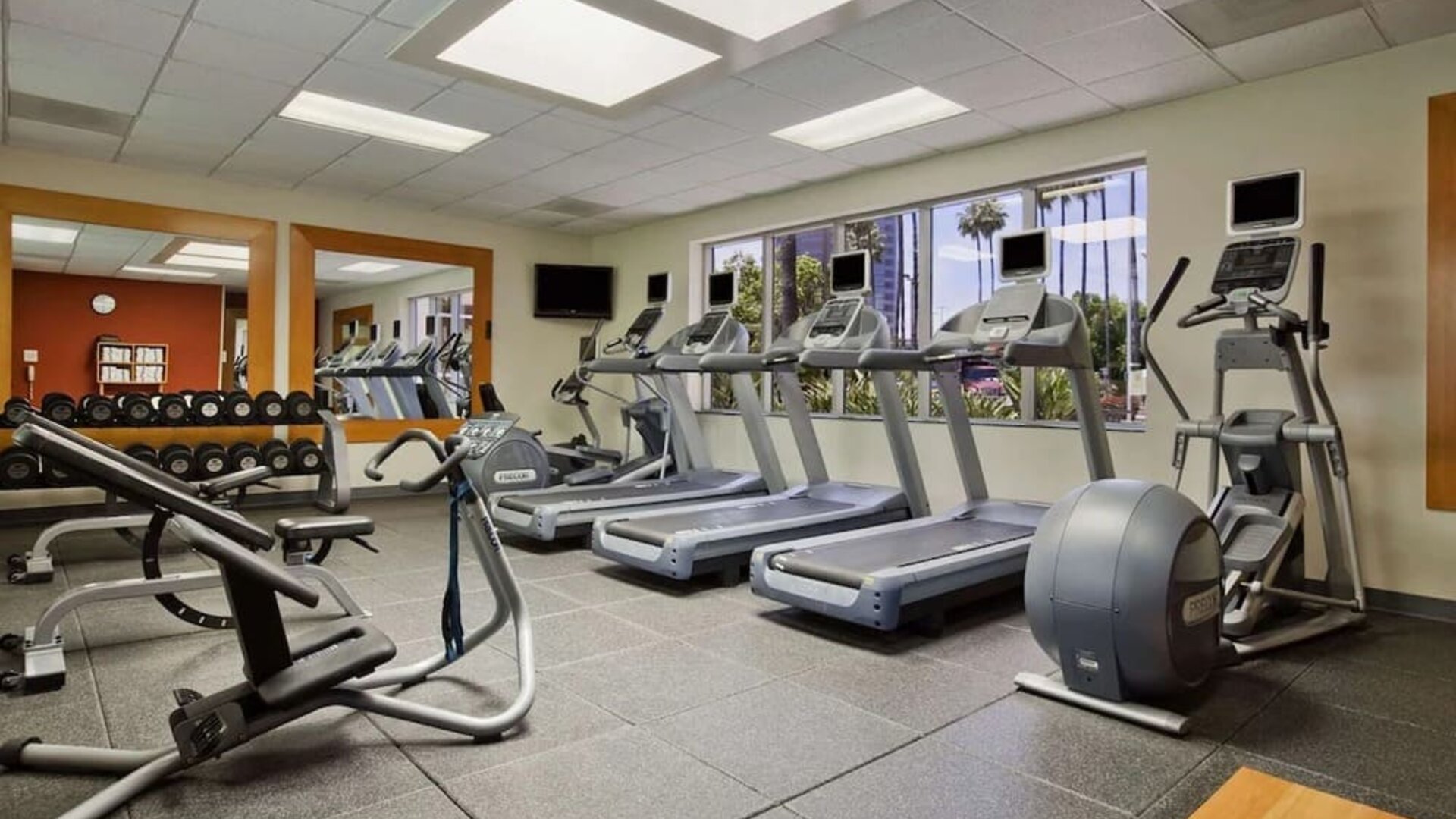Fully equipped fitness center at Embassy Suites By Hilton San Diego-La Jolla.
