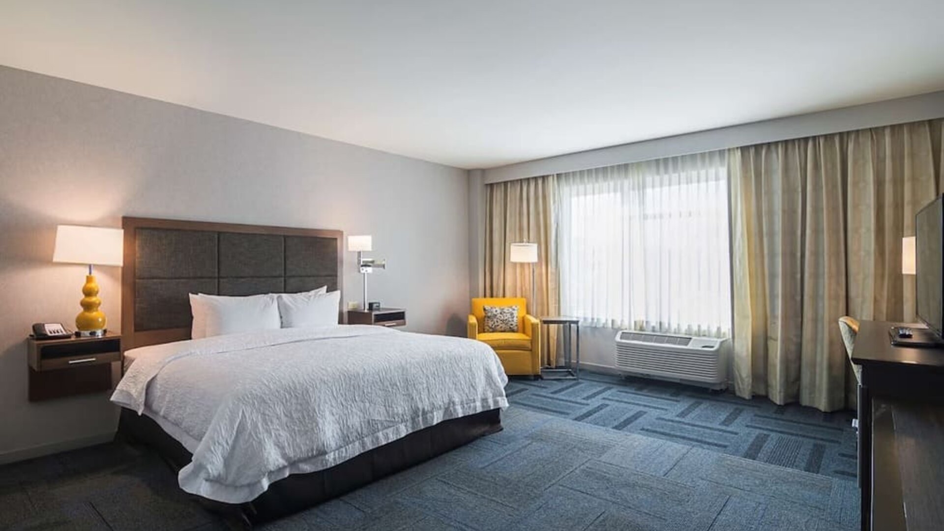 Spacious day use room with king bed at Hampton Inn Chicago North/Loyola Station.