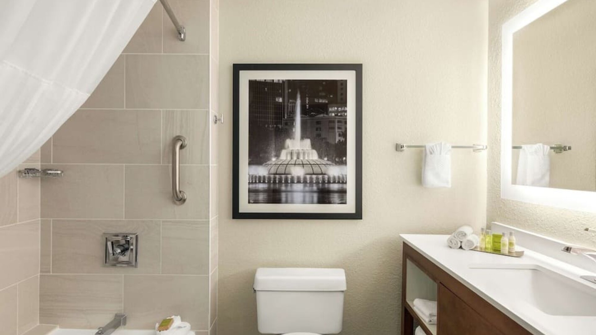 Guest bathroom with shower and tub at DoubleTree By Hilton Orlando Downtown.
