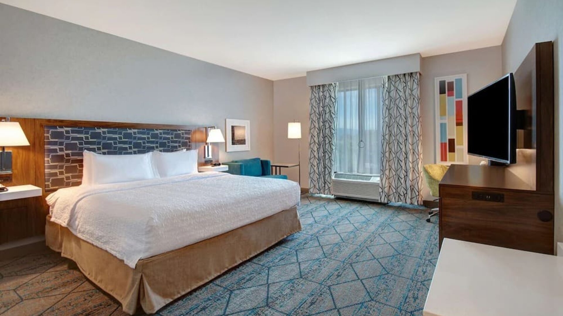 Spacious day use room with work desk at Hampton Inn & Suites Sunnyvale Silicon Valley.