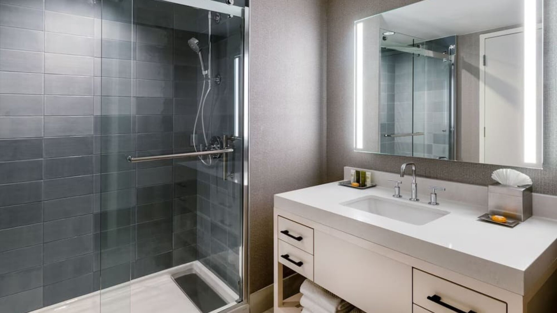 Guest bathroom with shower at Hilton Dallas Lincoln Centre.
