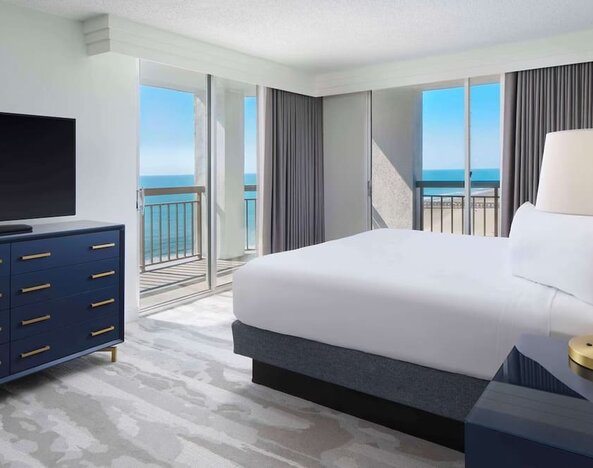 Day use room with balcony overlooking the ocean at Embassy Suites By Hilton Myrtle Beach Oceanfront Resort.