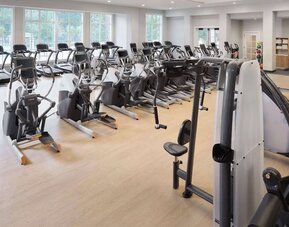 Well-equipped fitness center at Embassy Suites By Hilton Myrtle Beach Oceanfront Resort.