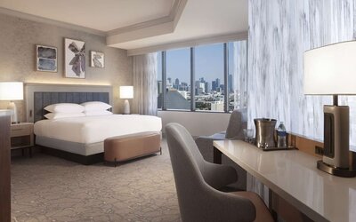 Day use room with work desk and sofa at Hilton Anatole.
