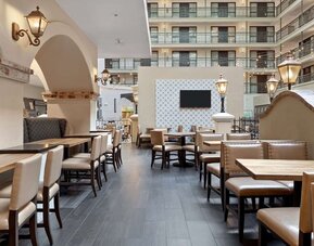 Breakfast area perfect for coworking at Embassy Suites By Hilton Los Angeles International Airport South.