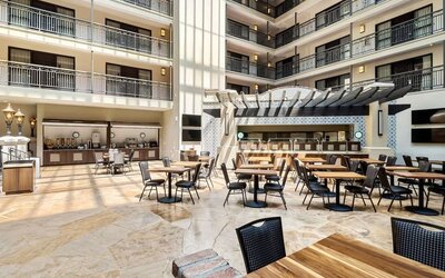 Dining area perfect for coworking at Embassy Suites By Hilton Los Angeles International Airport South.