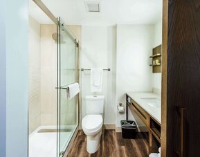 Guest bathroom with shower at Hilton Garden Inn Denver Union Station.