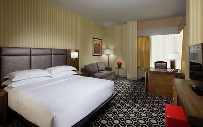 Day use room with work desk and sofa at Hilton Chicago-Northbrook.