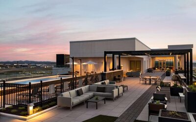 Hotel rooftop with lounge area and pool at Hilton BNA Nashville Airport Terminal.
