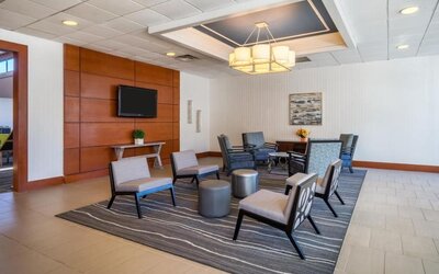 Lobby lounge at EnVision Hotel And Conference Center Mansfield Foxboro.