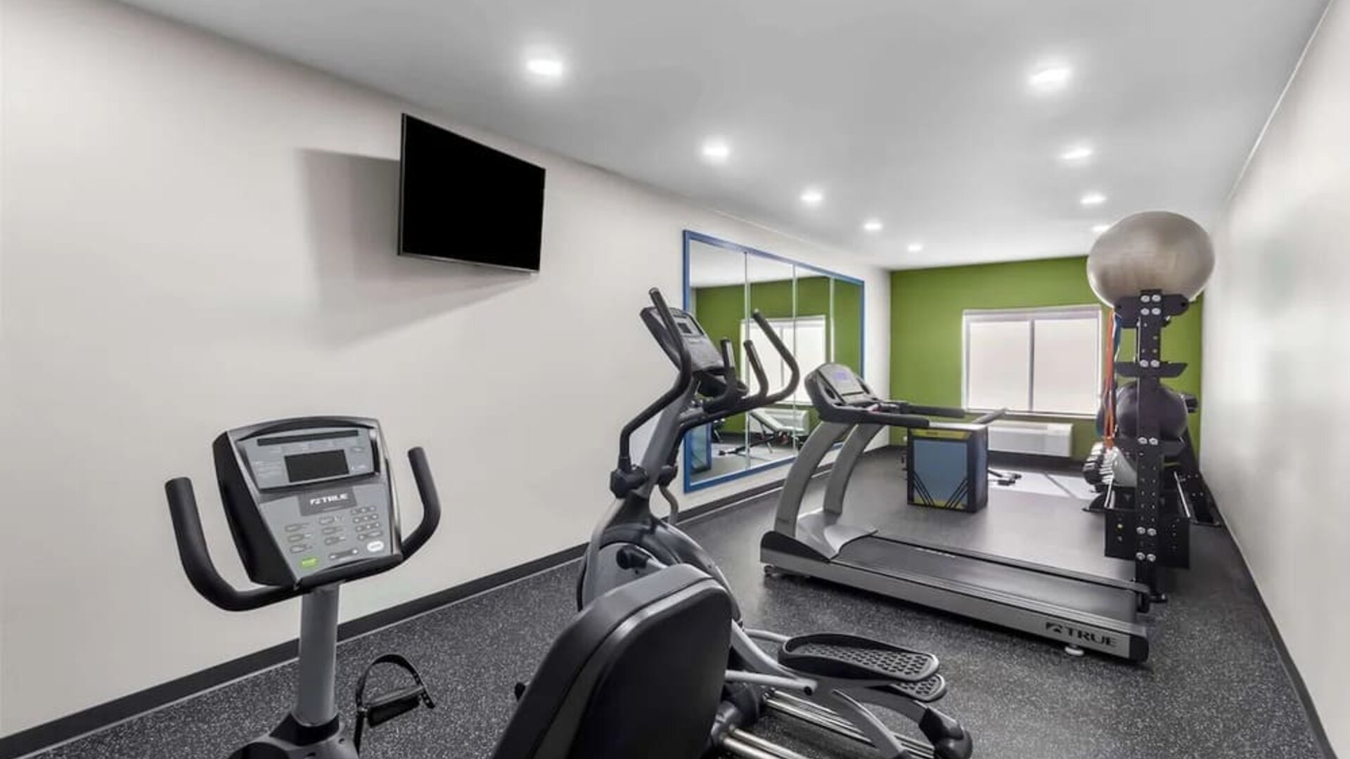 Well equipped fitness center at Spark By Hilton Pearland.